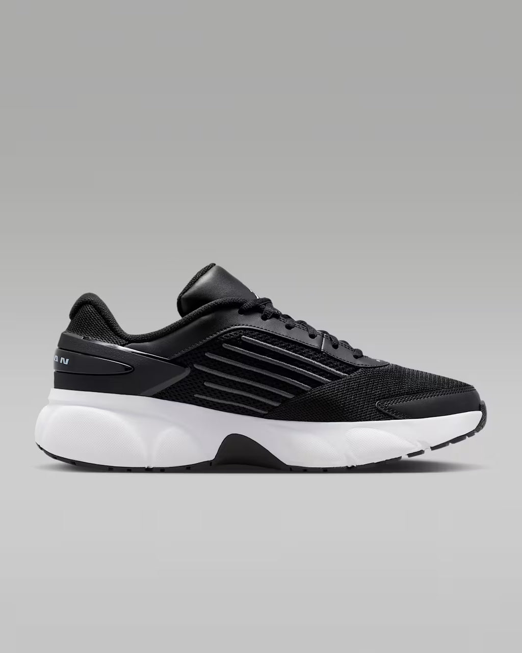 Black athletic shoe on a gray background