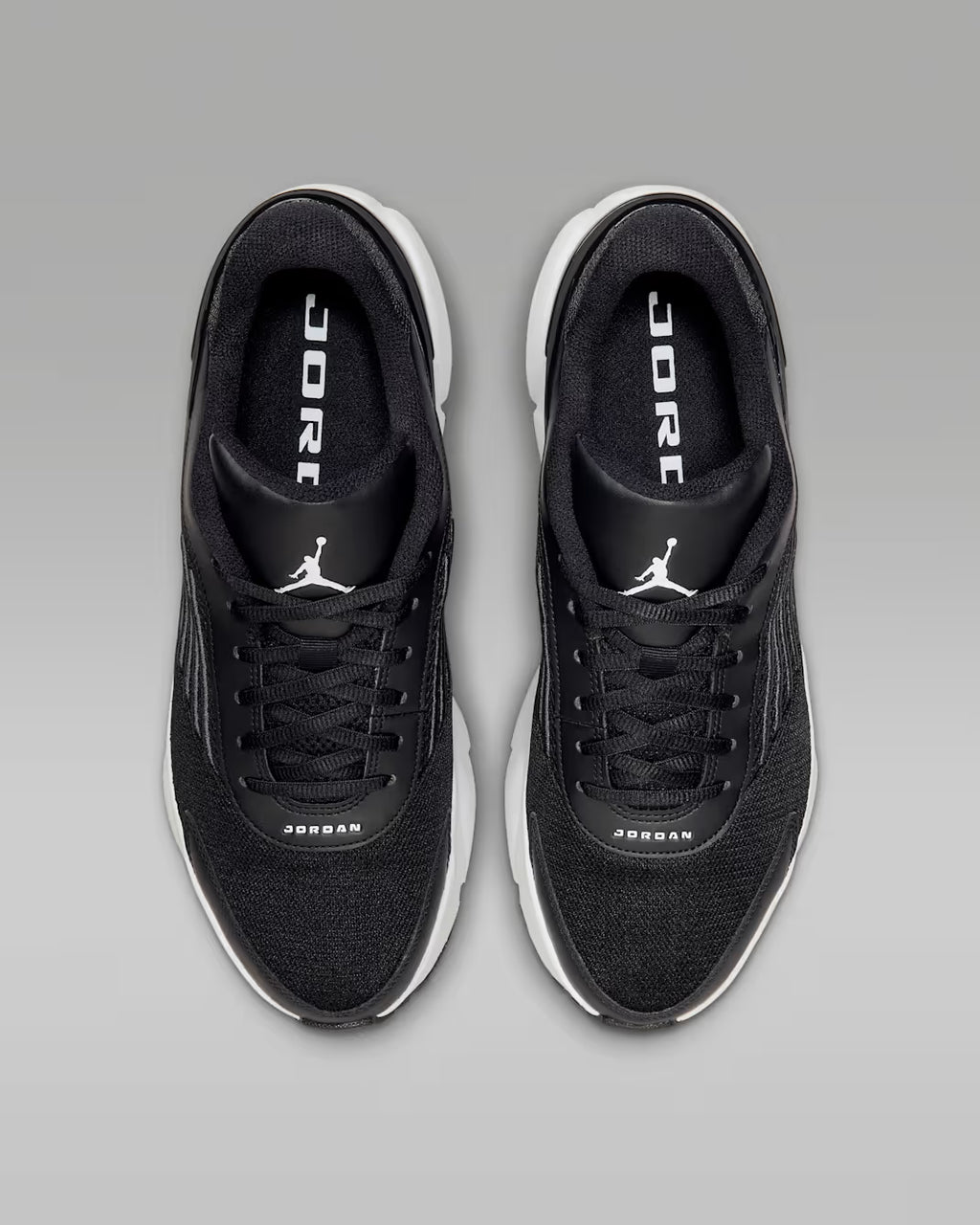 Black Jordan sneakers on a gray background