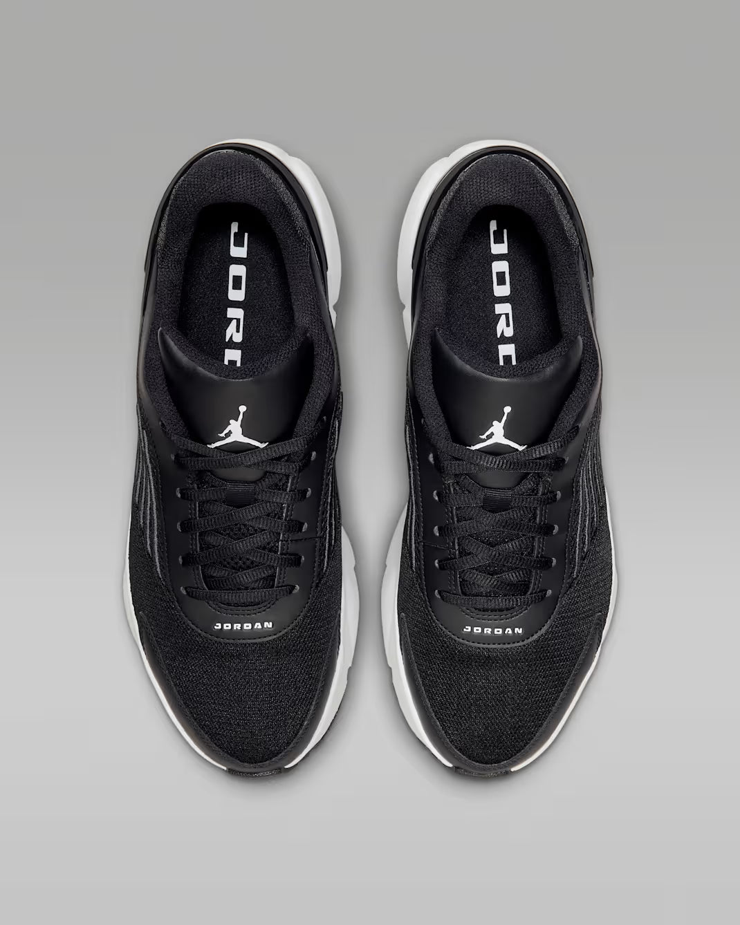 Black Jordan sneakers on a gray background